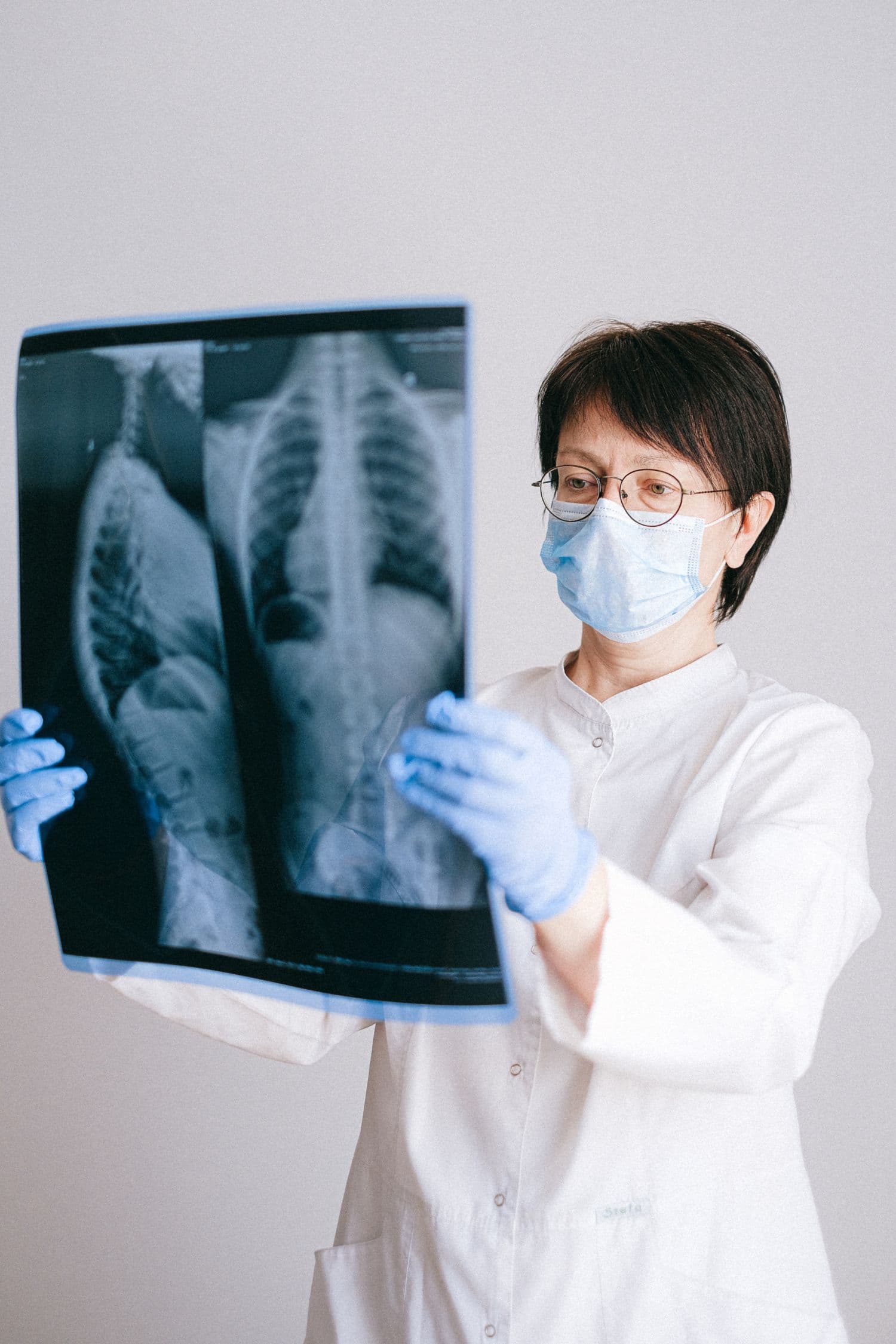 Orthopaedic specialist reviewing diagnostic imaging